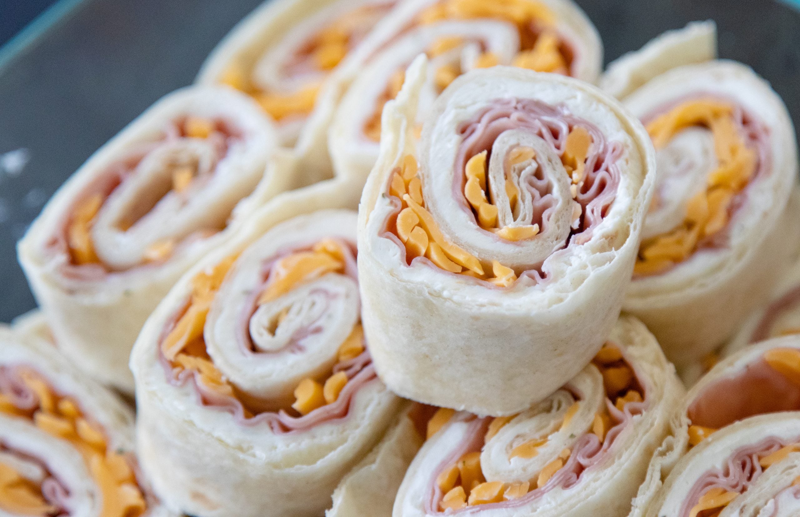 a stack of pinwheels in a dish