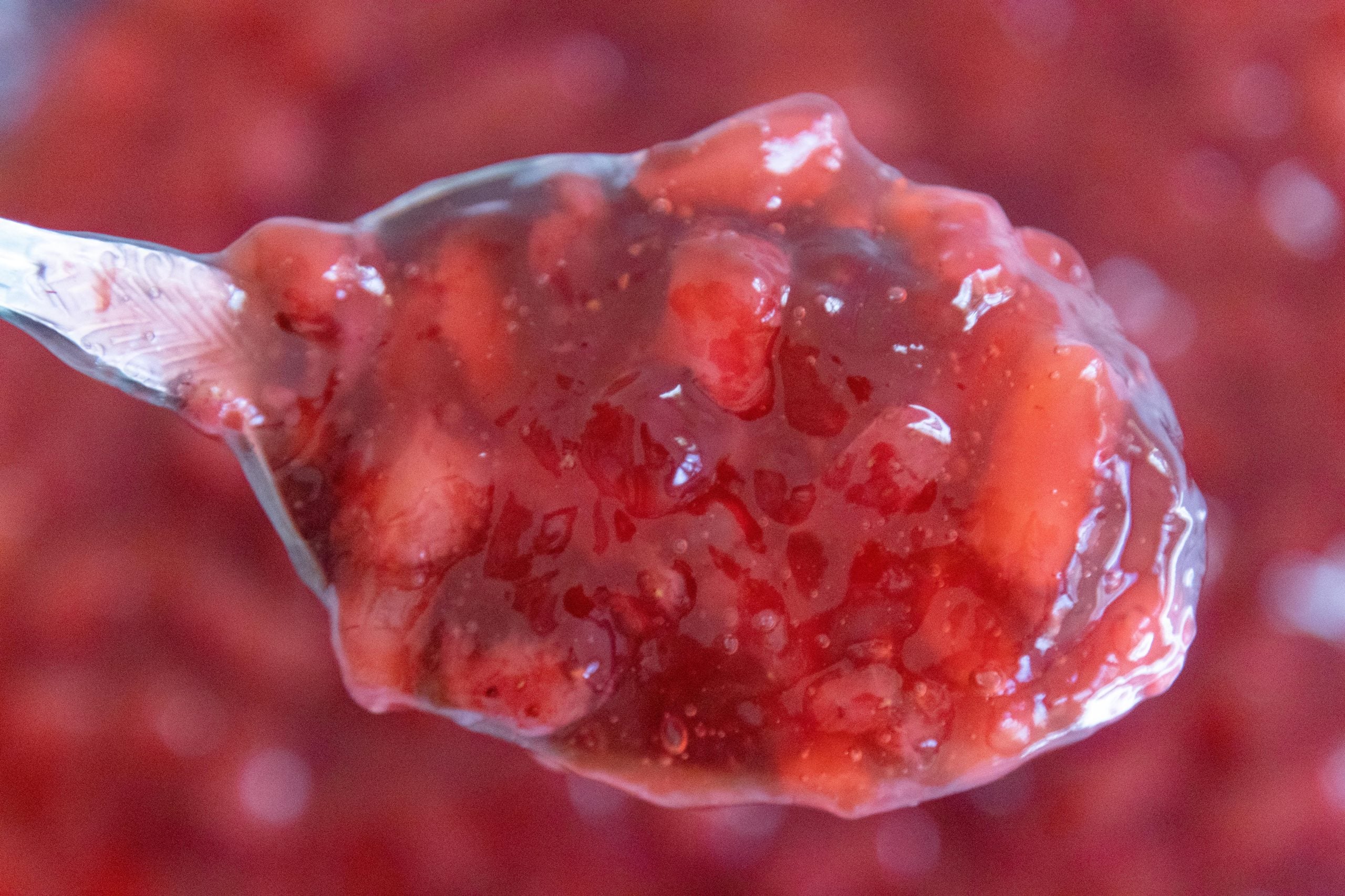 spoon full of strawberry dessert
