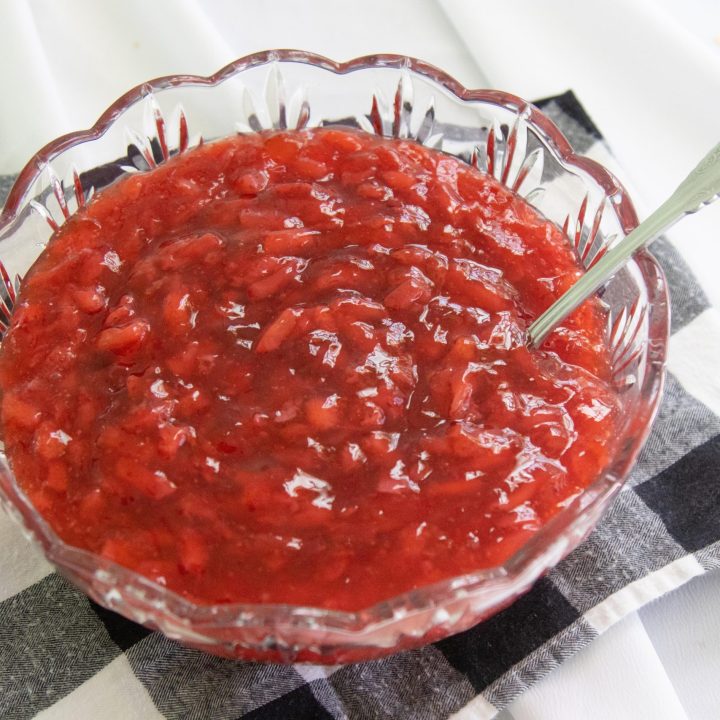 cut glass bowl containing strawberry dessert