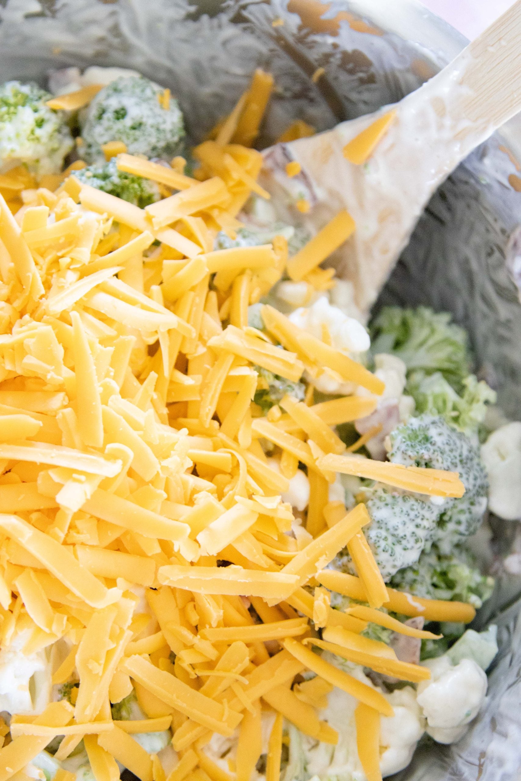 broccoli cauliflower salad in a mixing bowl