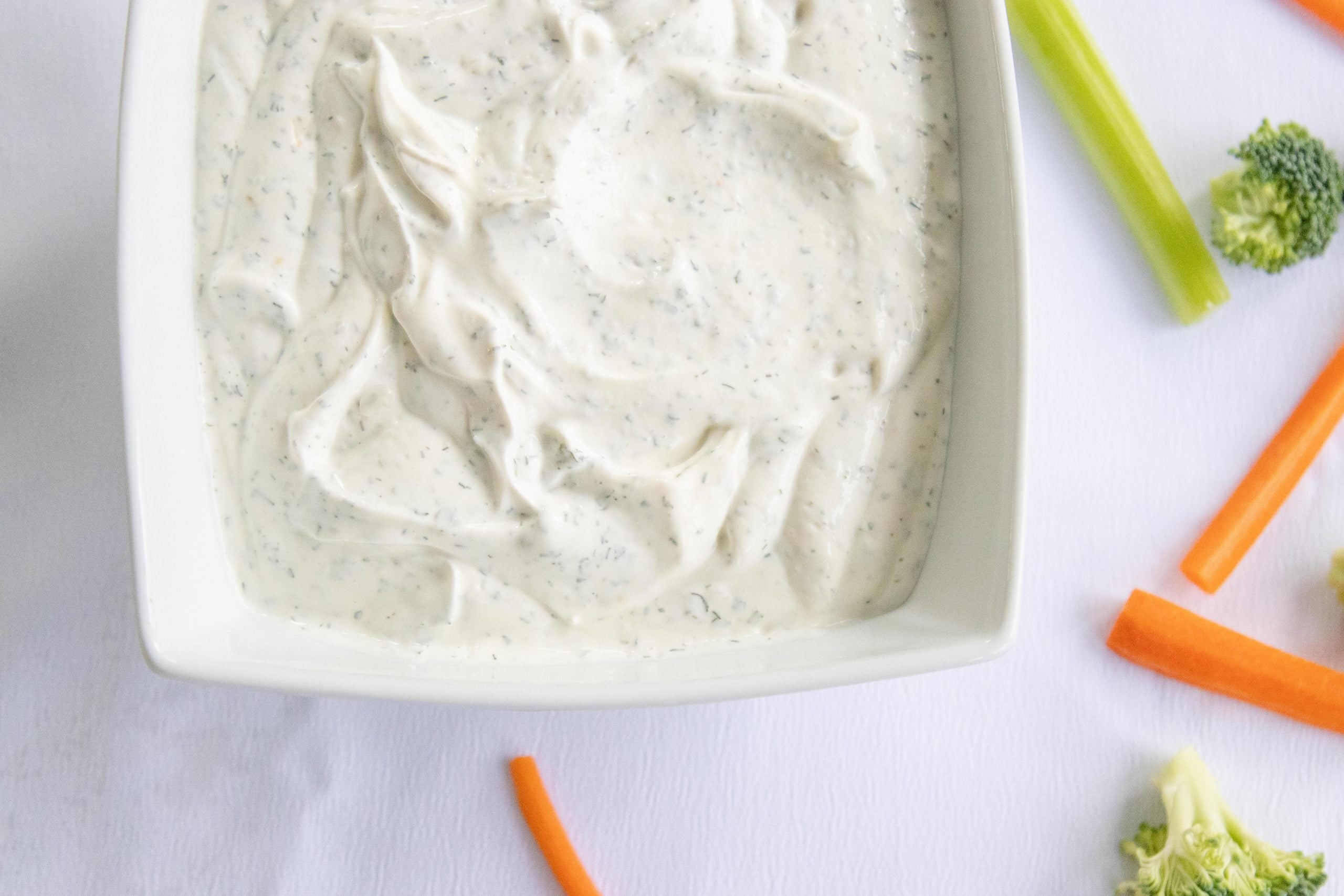 homemade ranch veggie dip in a white dish