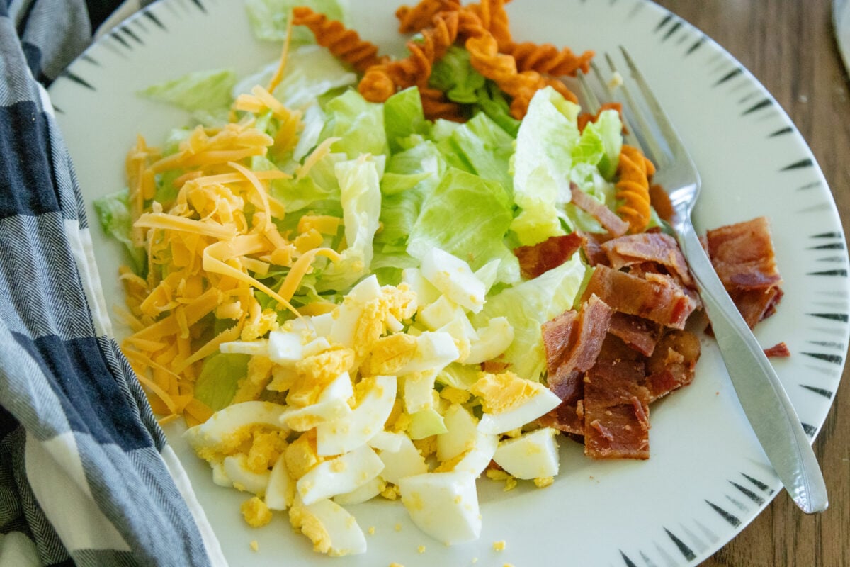 a serving of corn chip lettuce salad on a plate