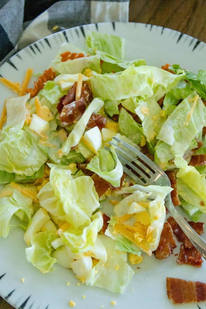 a serving of corn chip lettuce salad on a plate