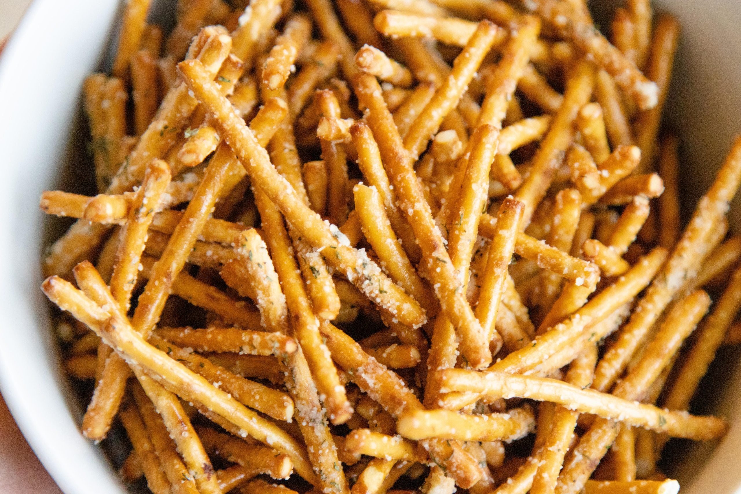ranch sesaoned pretzels in a stainless steel bowl