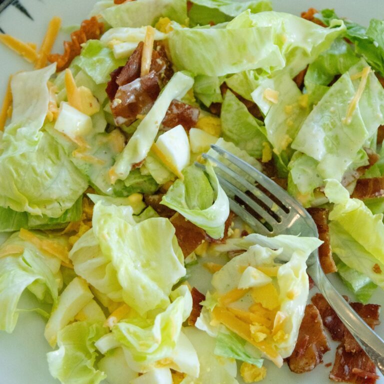 a serving of corn chip lettuce salad on a plate