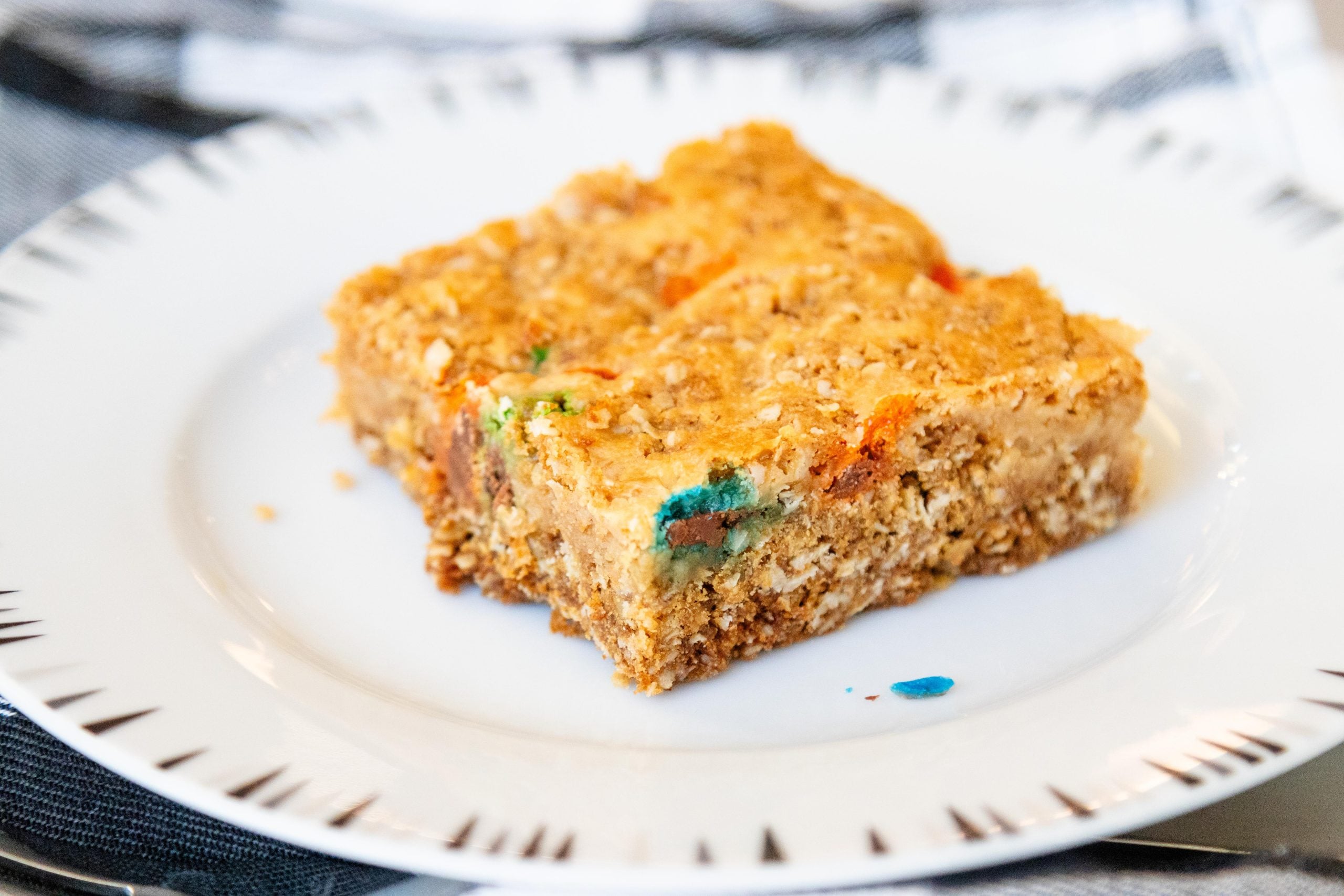 one m&M dream bar on a white plate