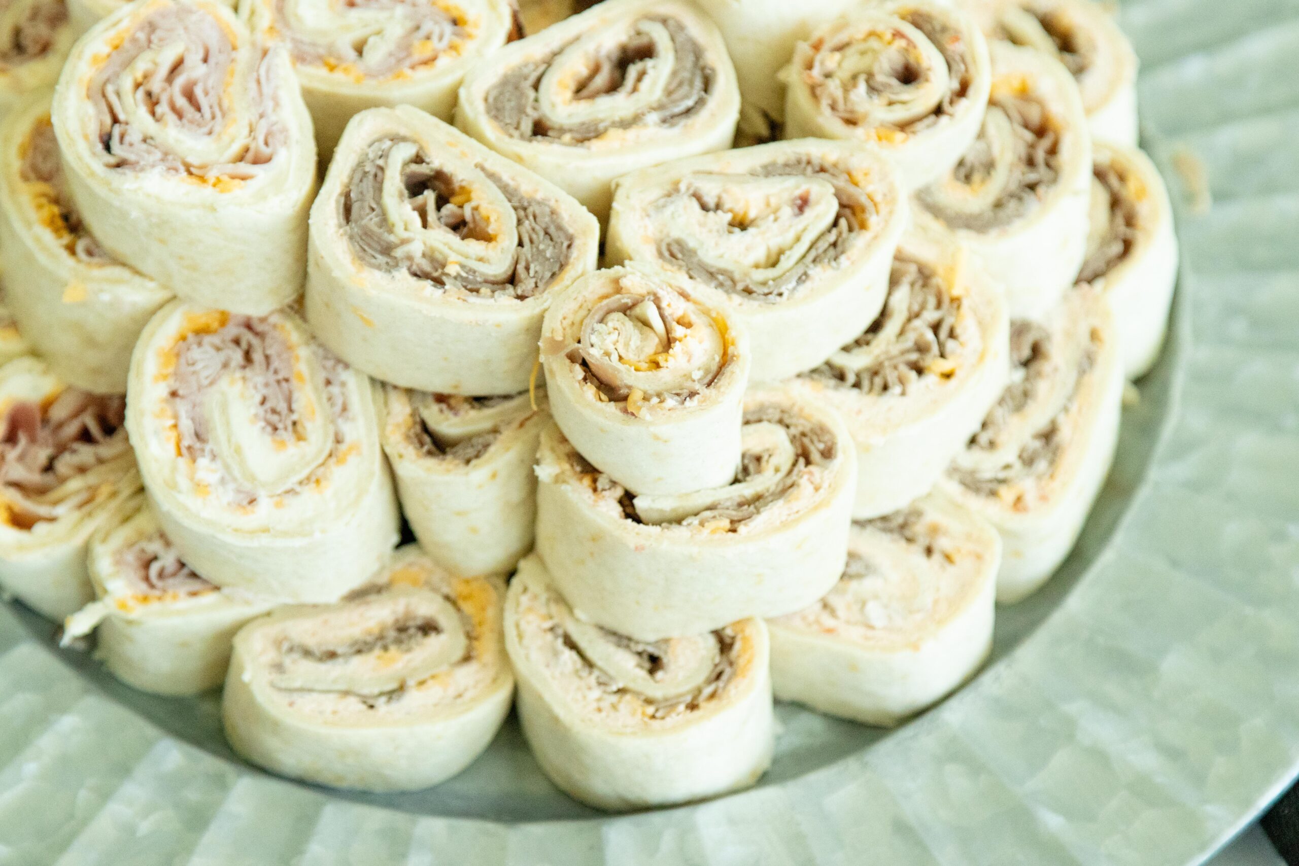 a stack of pinwheels on a tray