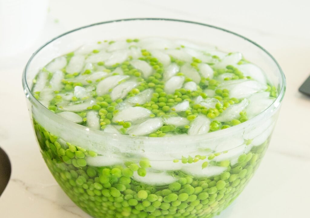 peas in an ice water bath