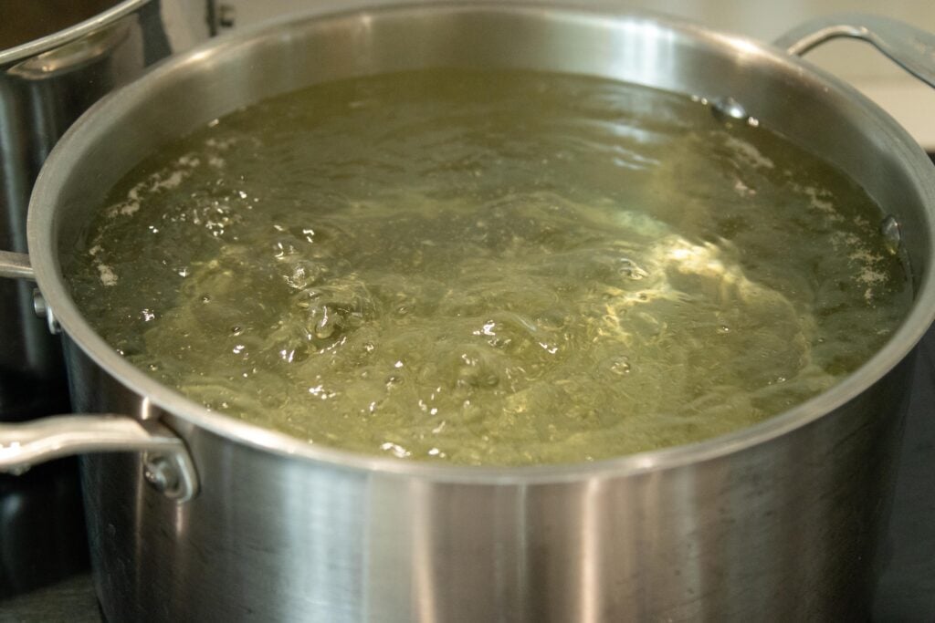 a pot of boiling water on the stovetop