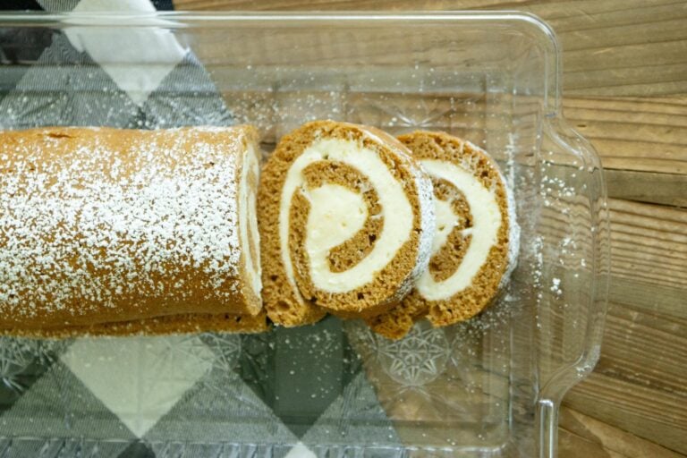 pumpkin cake roll on a clear tray