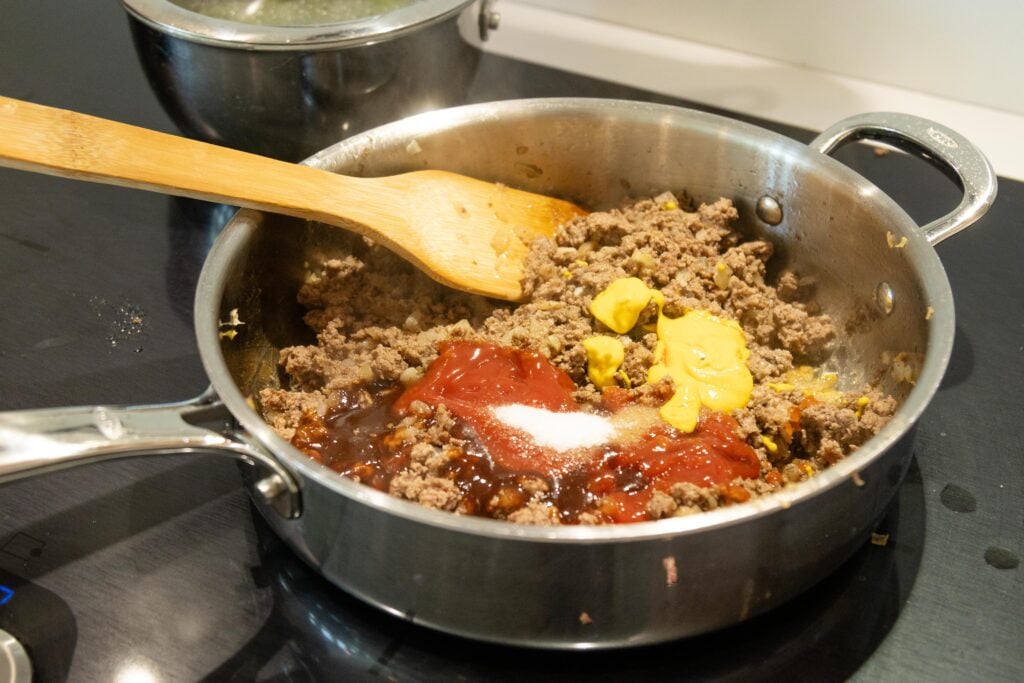 ground beef and sloppy joe ingredients in a pan