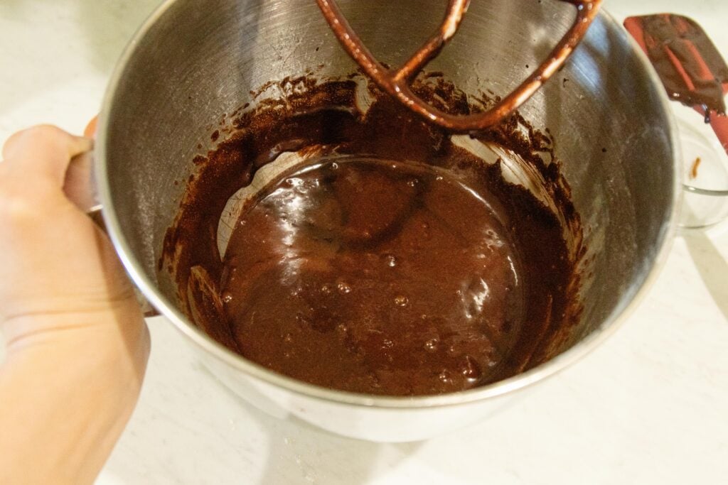 chocolate batter in the bowl of the stand mixer