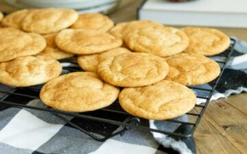 snickerdoodle cookies cooling on a wire rack
