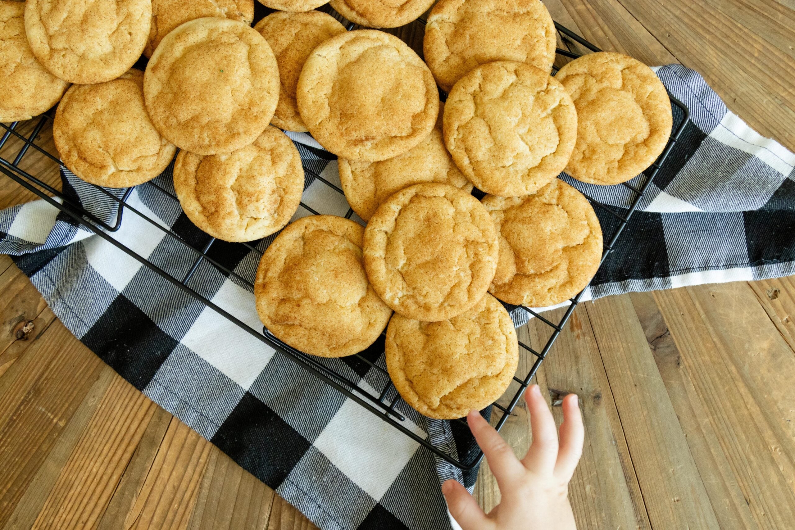 snickerdoodle cookies cooling on a wire rack