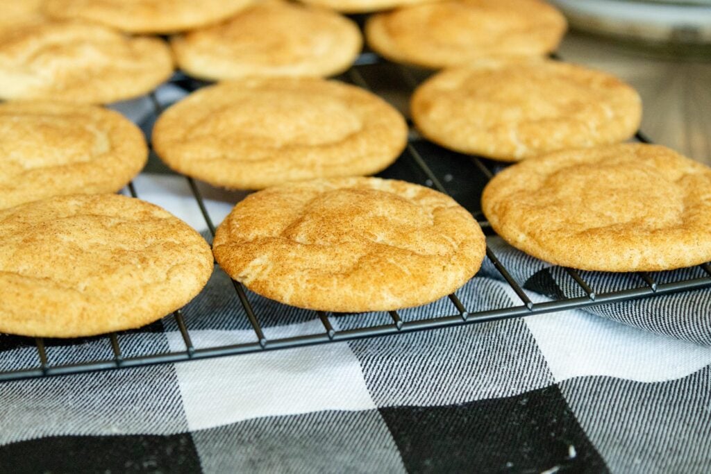 snickerdoodle cookies cooling on a wire rack