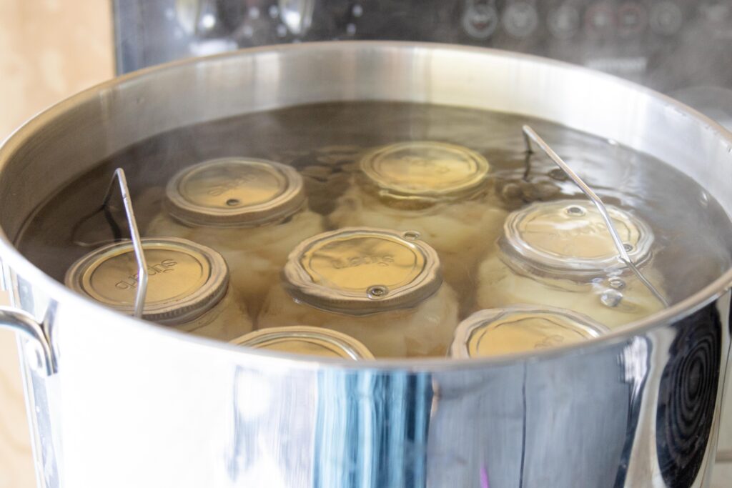 bubbling water bath canner on the stovetop