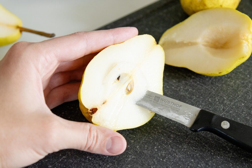 coring the pear with a paring knife
