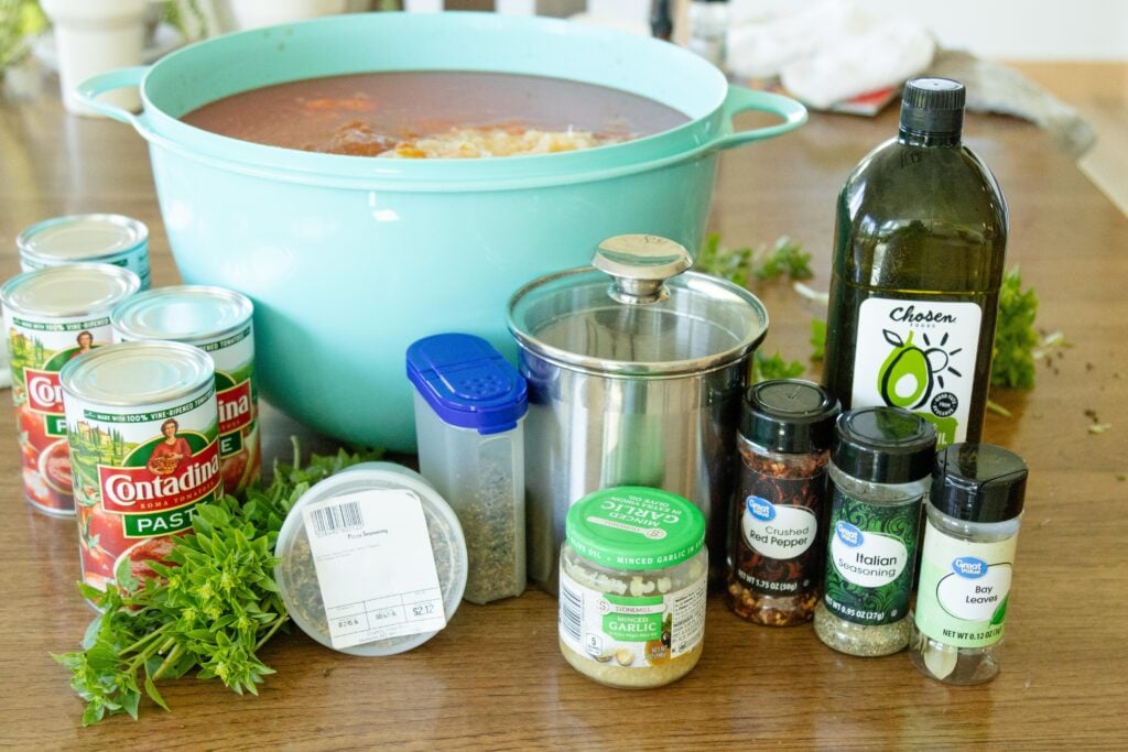 a bunch of important ingredients needed to make pizza sauce setting on the table