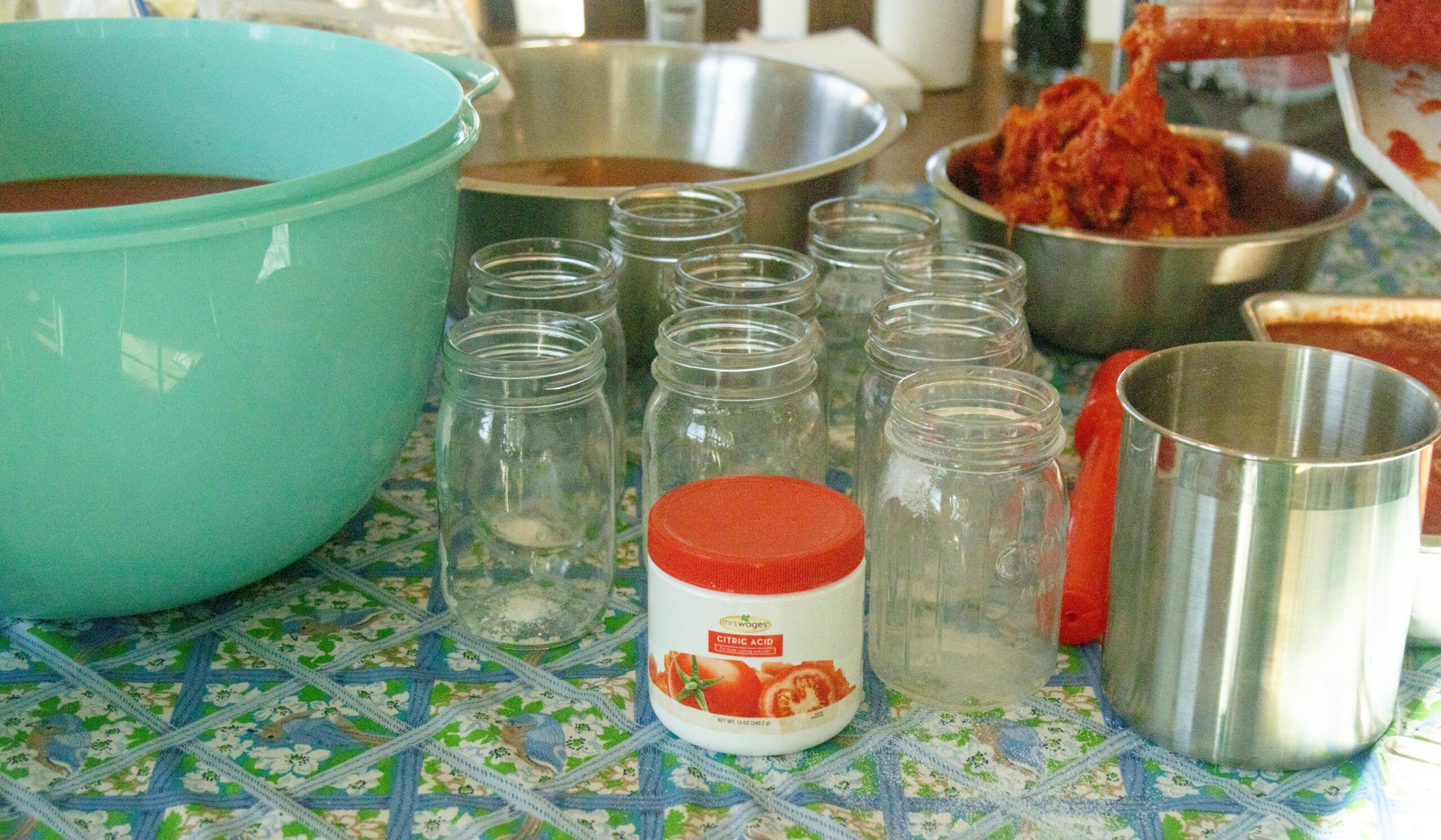 empty jars and canning supplies on the table