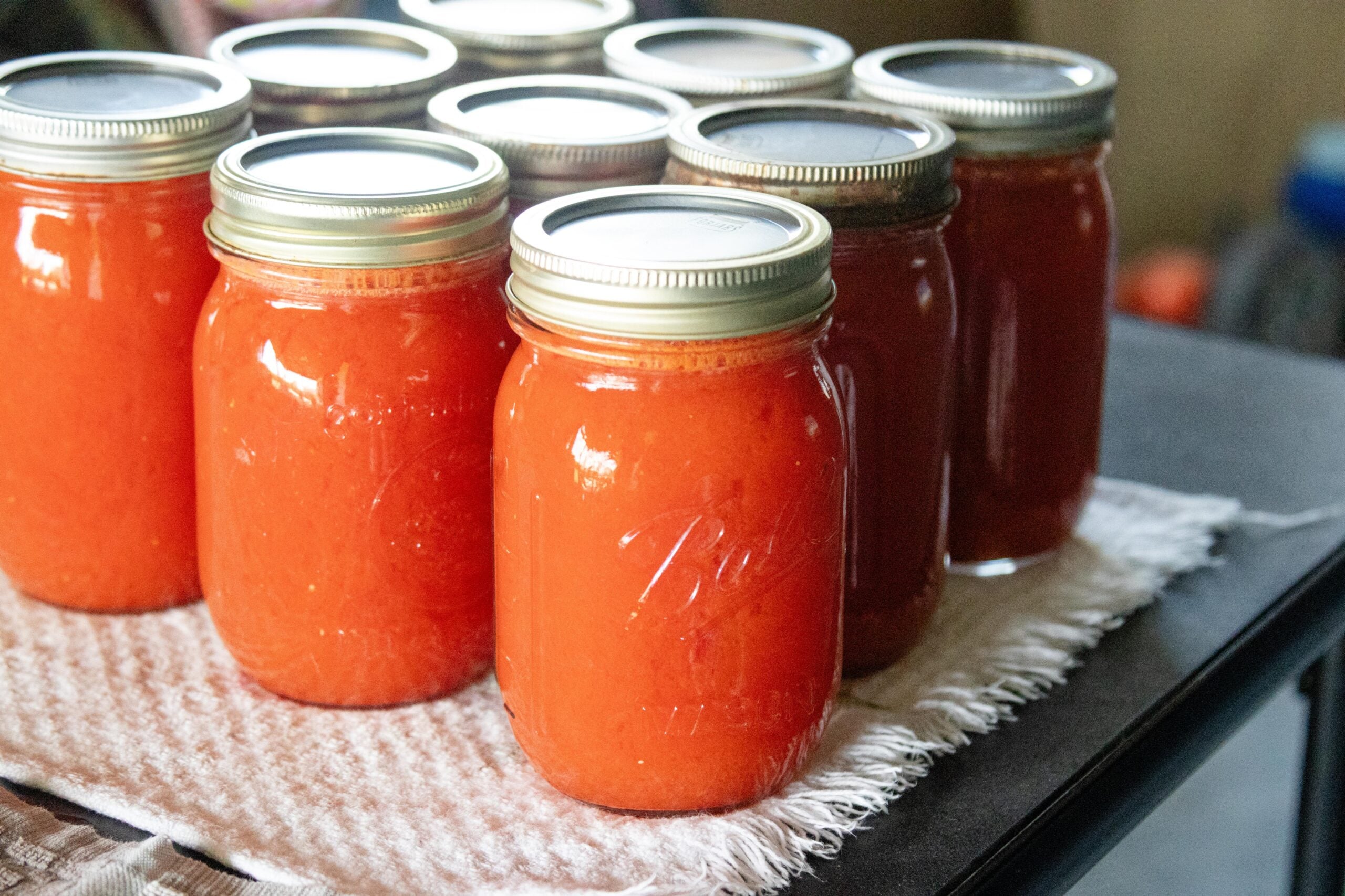 freshly canned tomato juice setting on the table