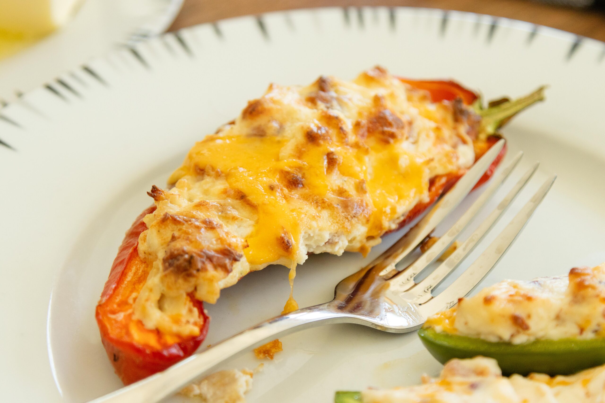stuffed pepper on a plate with a fork