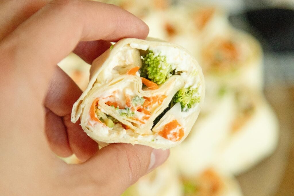 hand holding a tortilla pinwheel