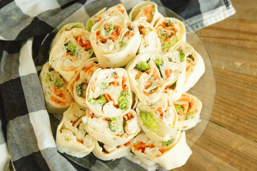 a plate of tortilla pinwheels on the counter