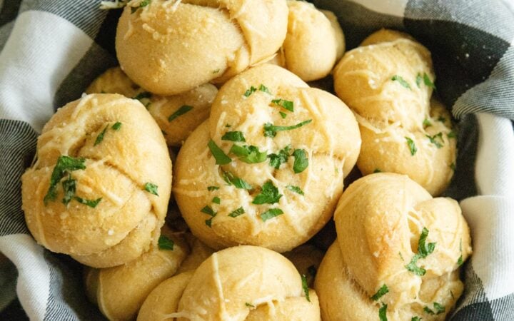 a bowl of homemade parmesan garlic knots