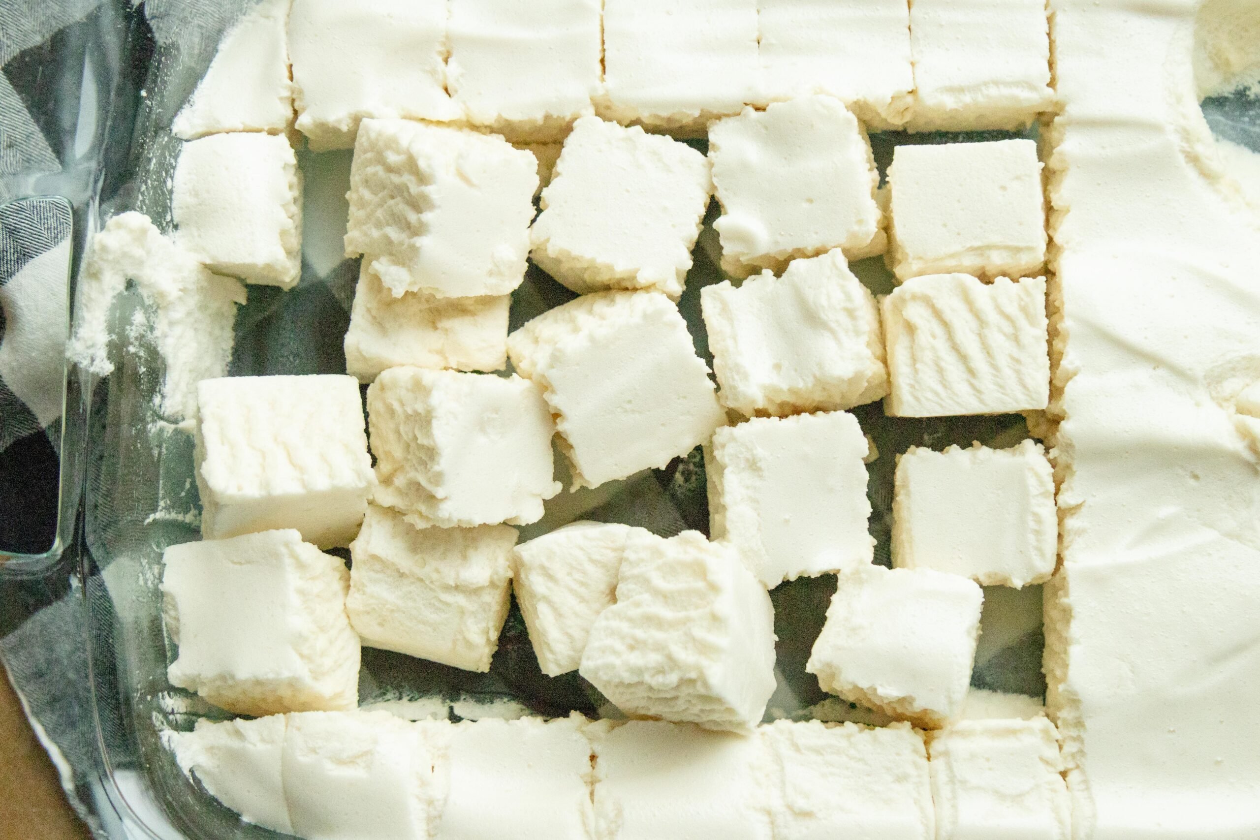 a bunch of cut marshmallows in a pan
