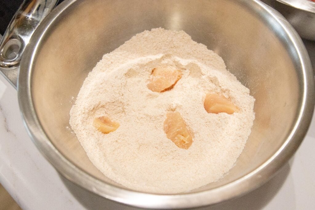coating the chicken in flour