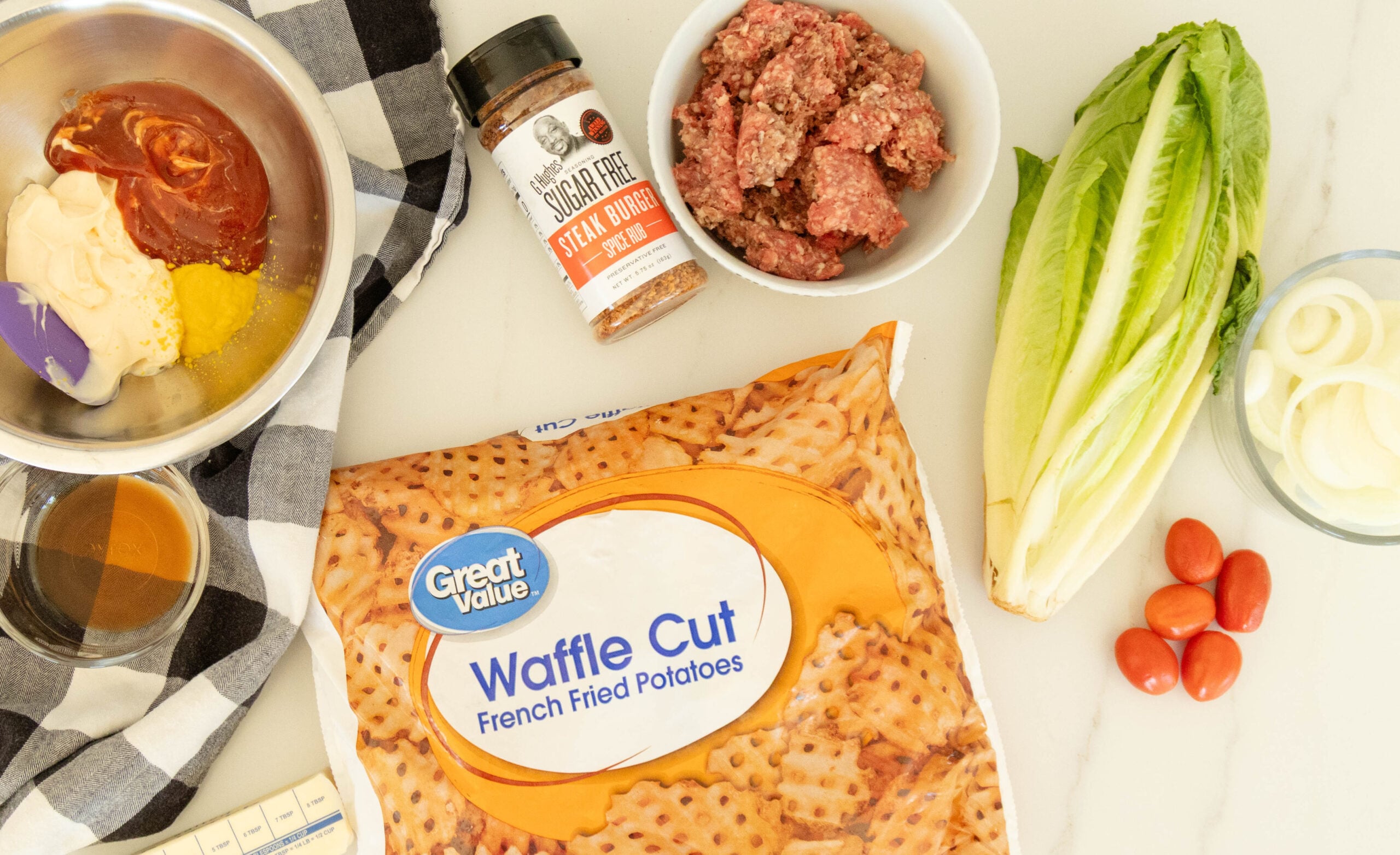 all the ingredients foe burger bowls setting on the counter