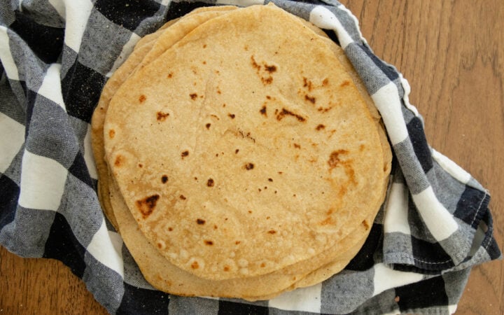 easy soft flour tortillas on a stack