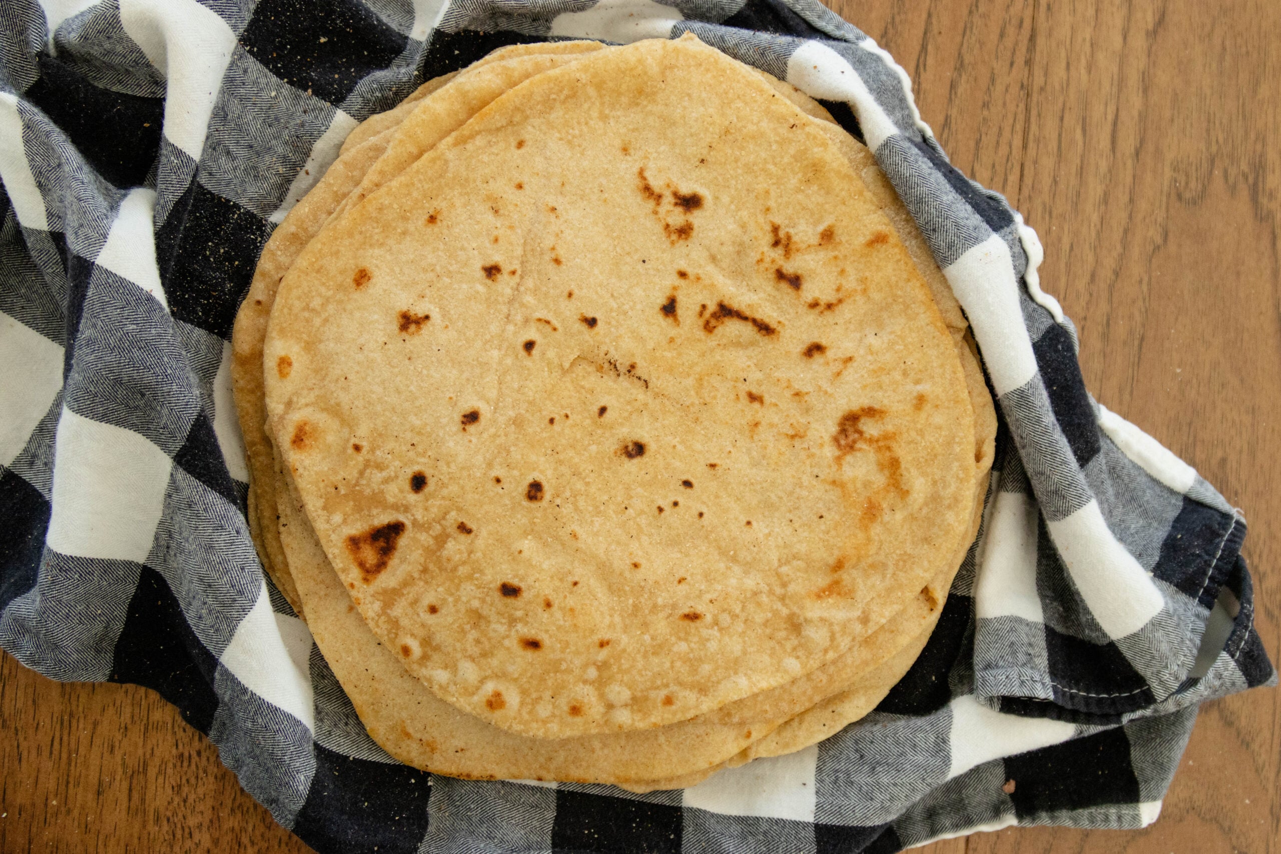 easy soft flour tortillas on a stack