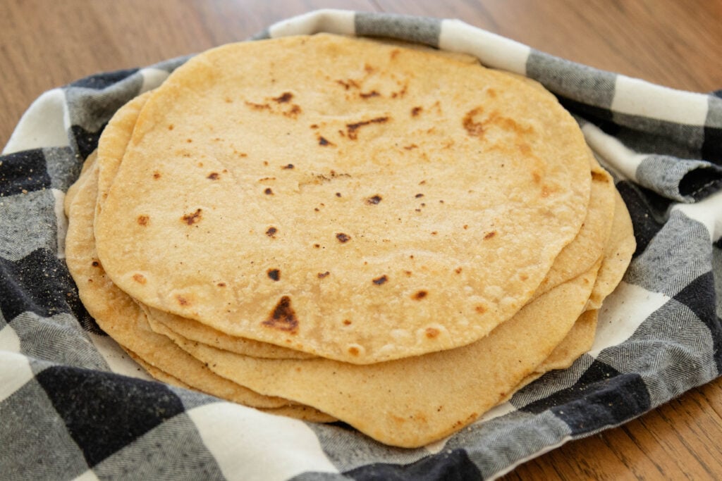 easy soft flour tortillas on a stack