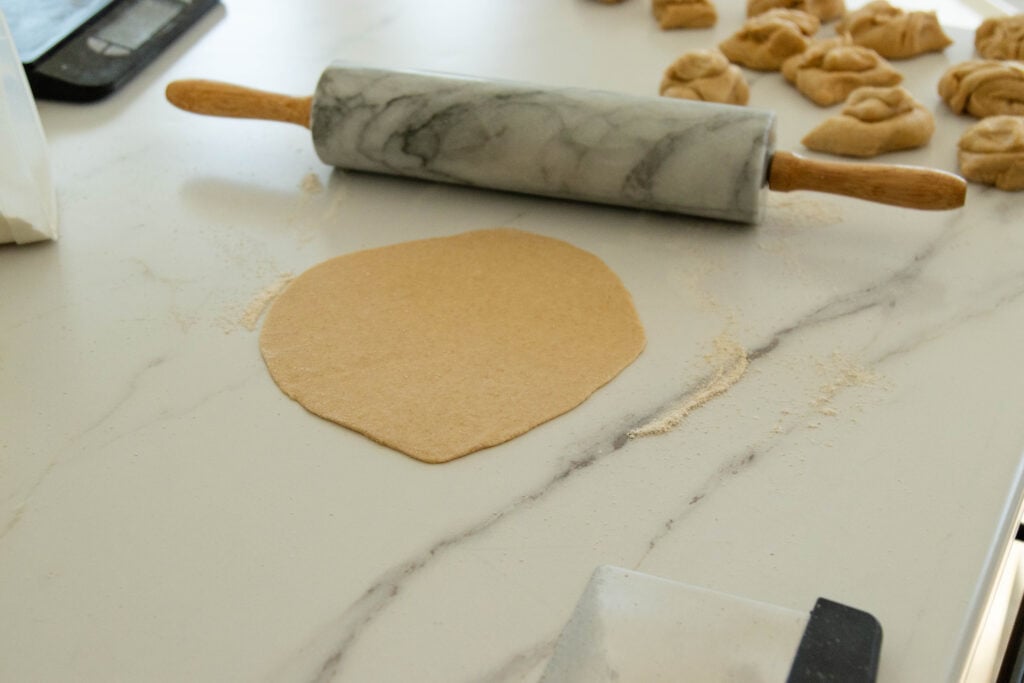 a tortilla, rolled out and ready to be fried