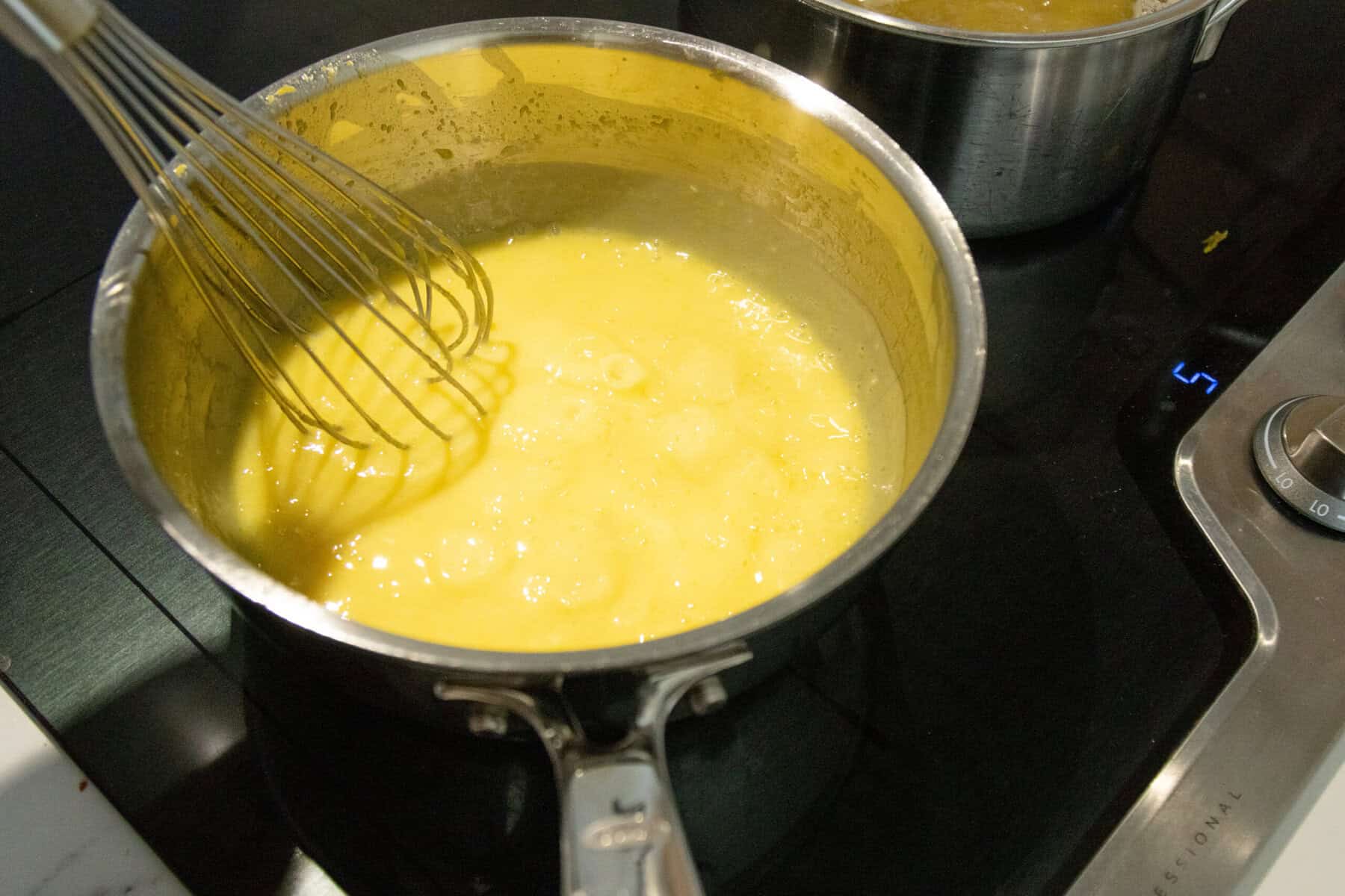 whisking the macaroni salad dressing mixture