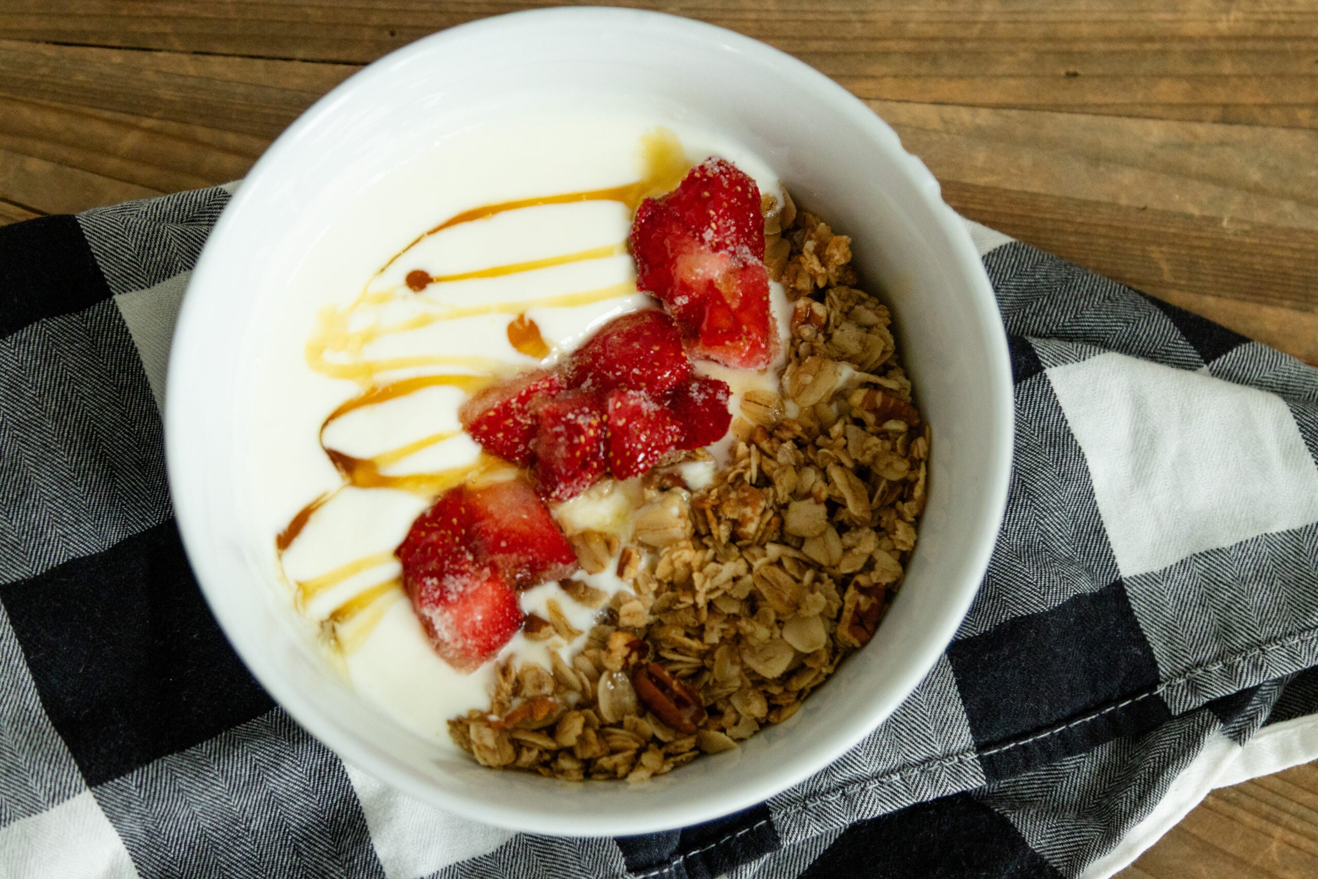 a yogurt parfait in a white bowl
