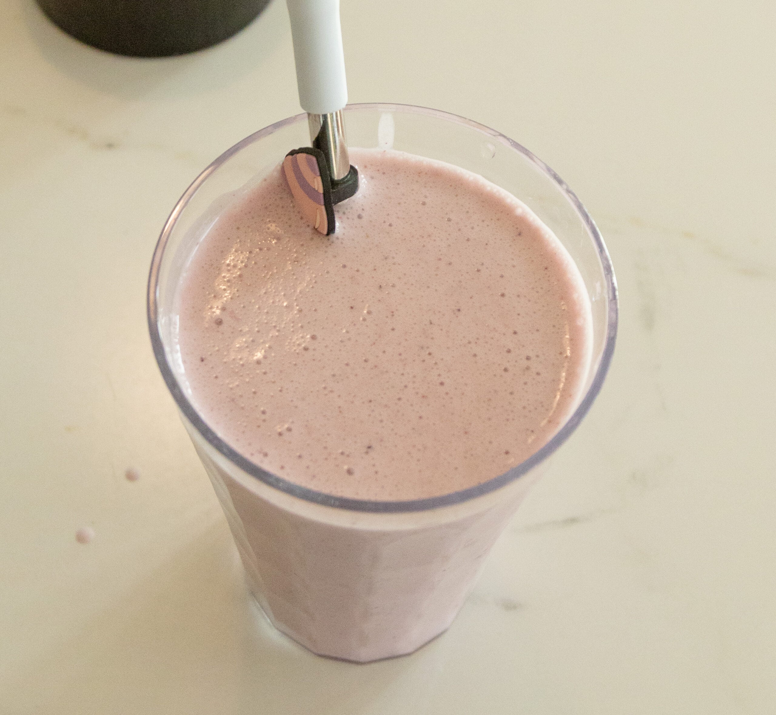 a raw milk yogurt smoothie in a clear cup