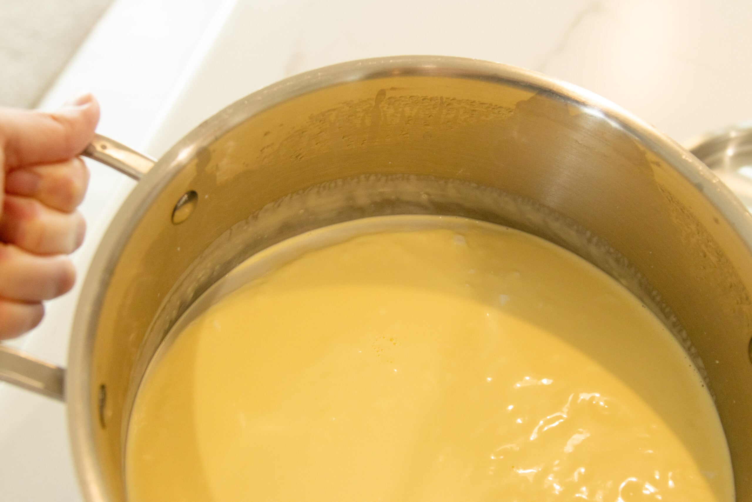 tipping the yogurt pot to see if its done