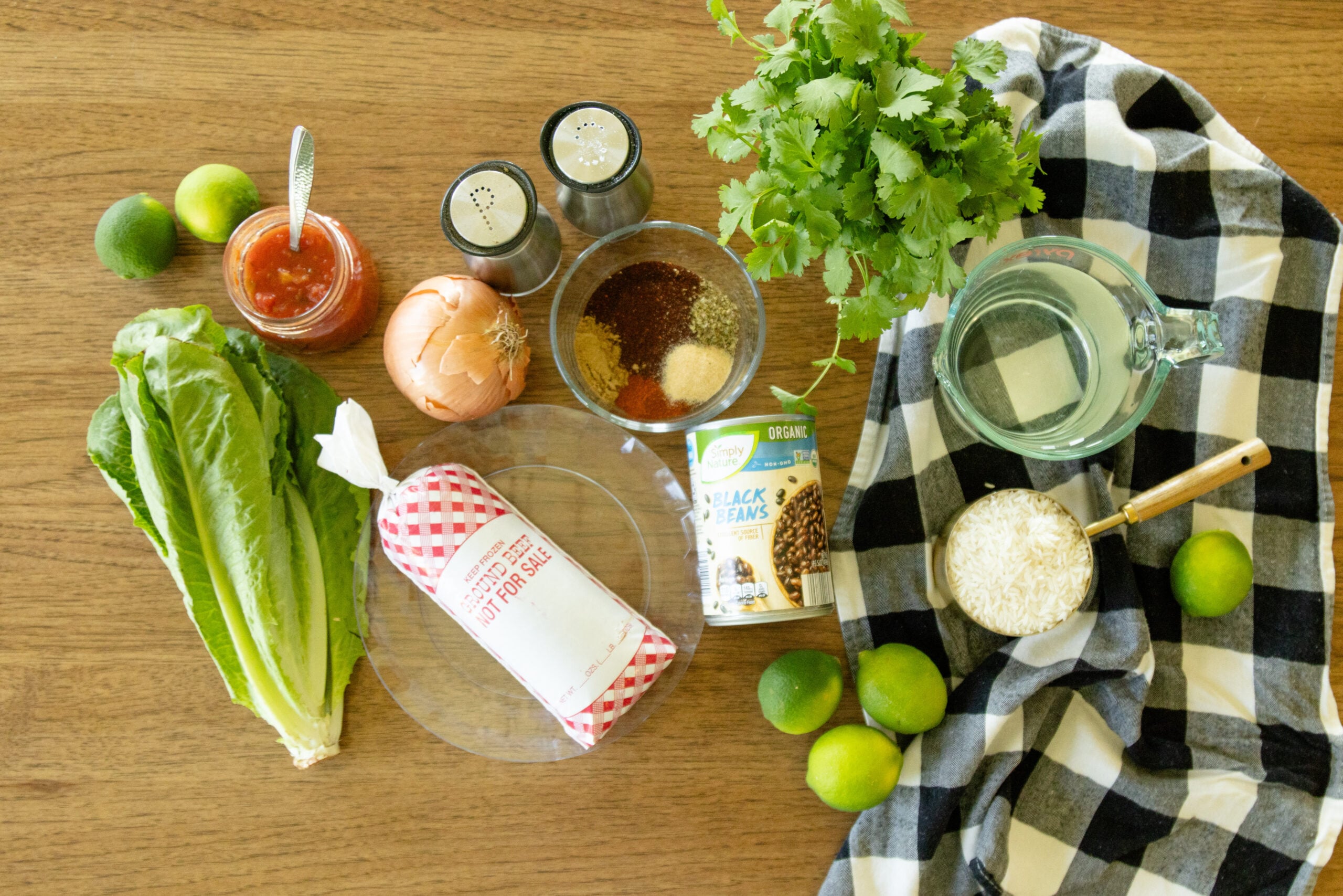 ingredients for ground beef taco bowls setting on the counter