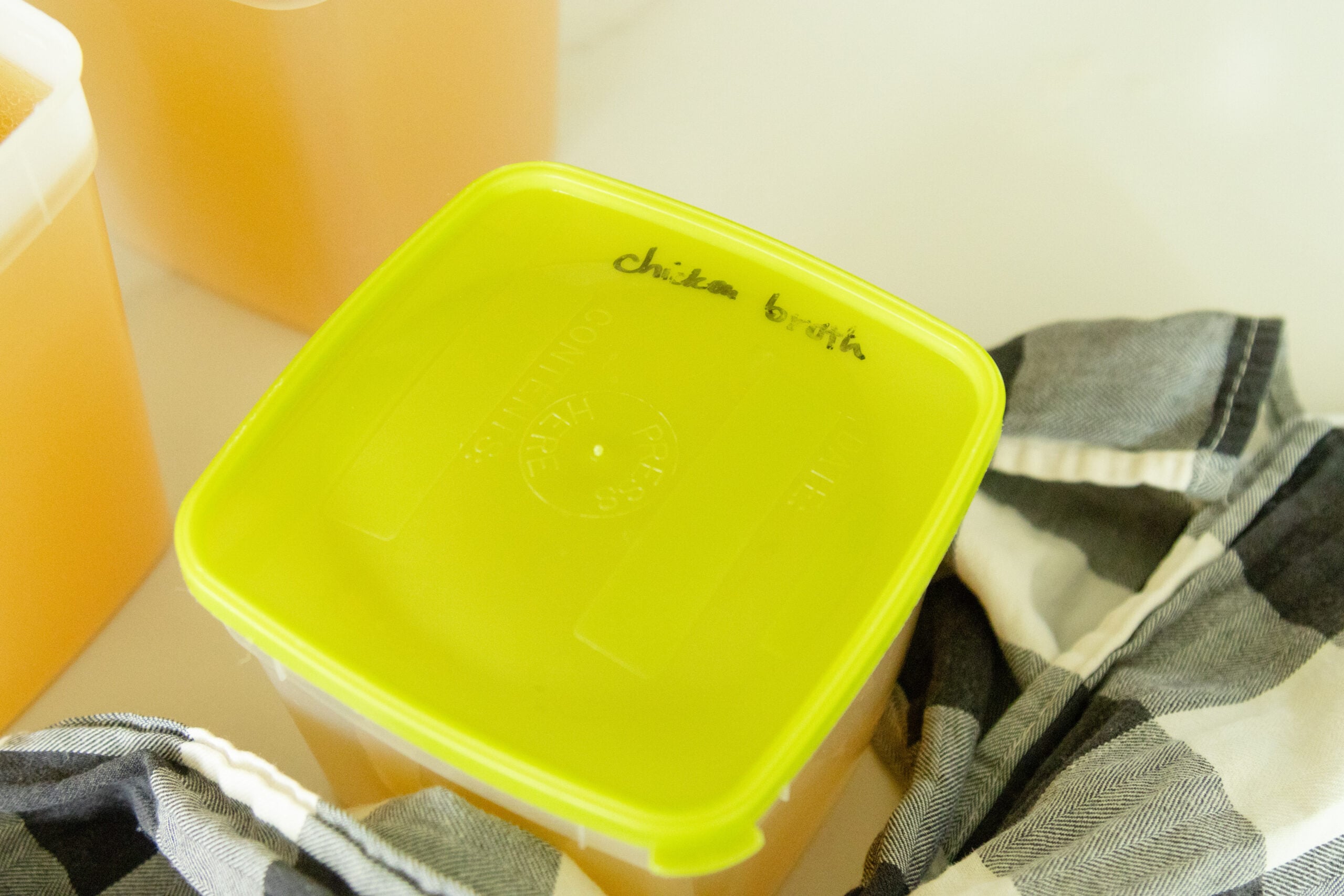 a container of bone broth ready for the freezer