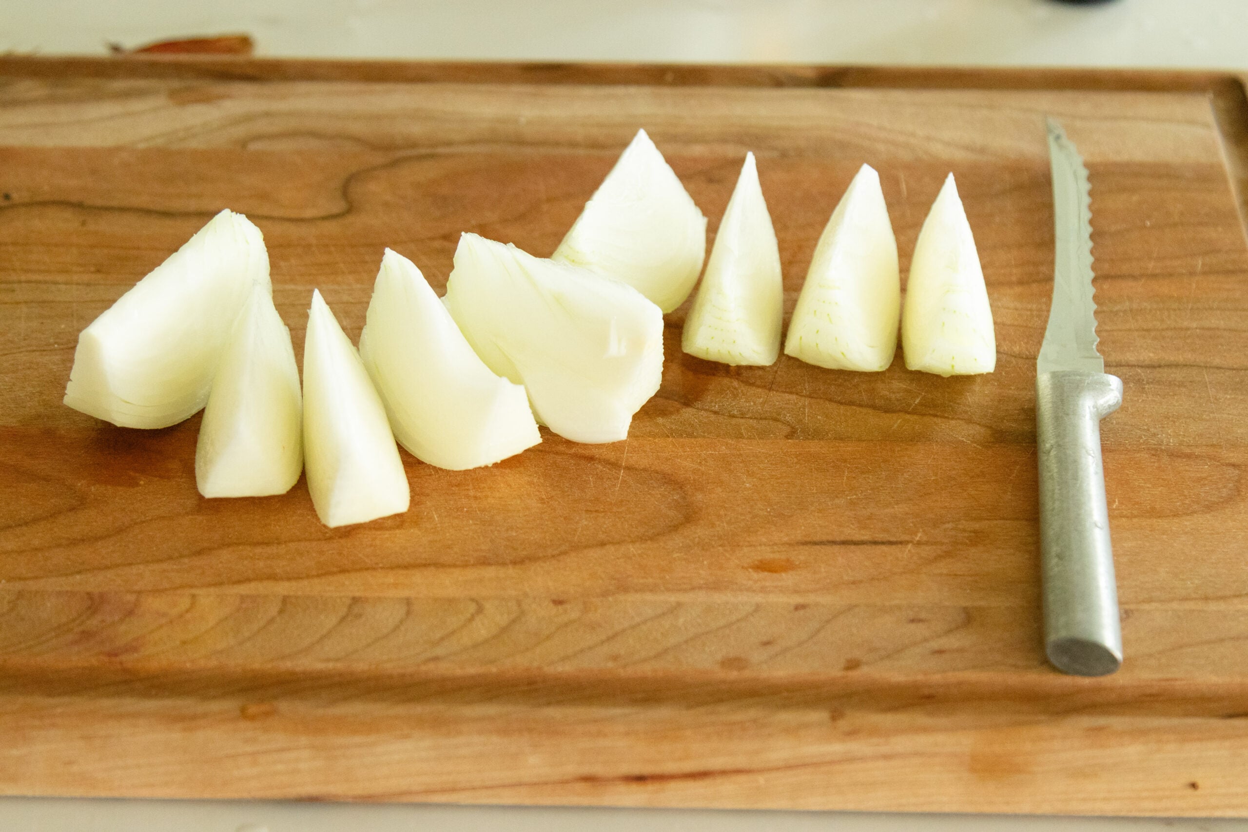 chopped onion setting on the cutting board
