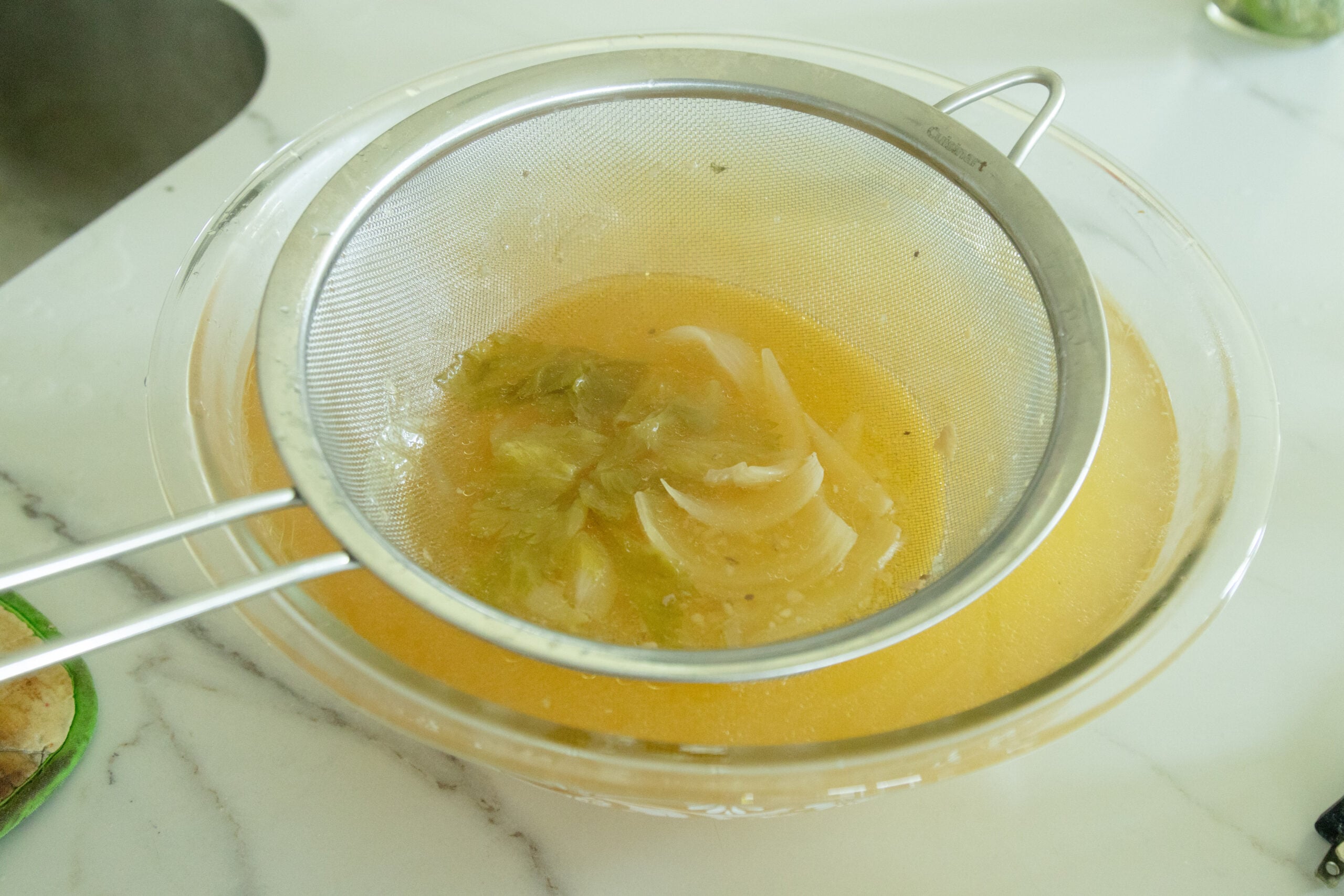 straining the chicken broth