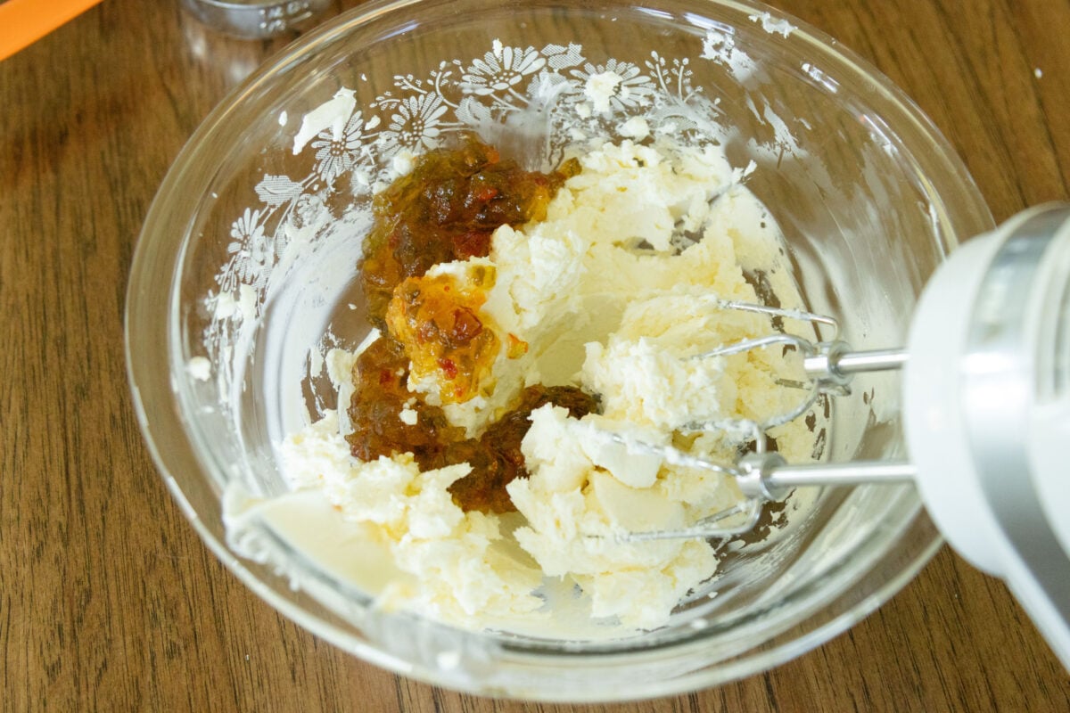 cream cheese and pepper jelly in a bowl