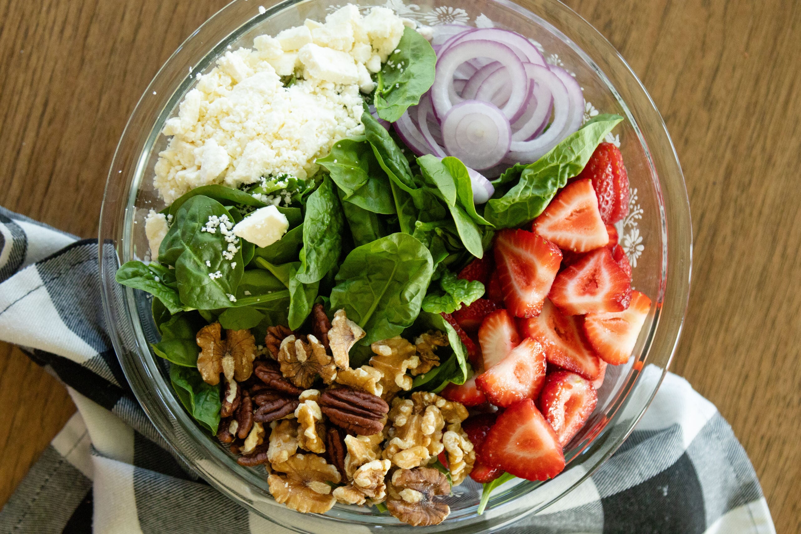 strawberry spinach feta salad in a galss bowl