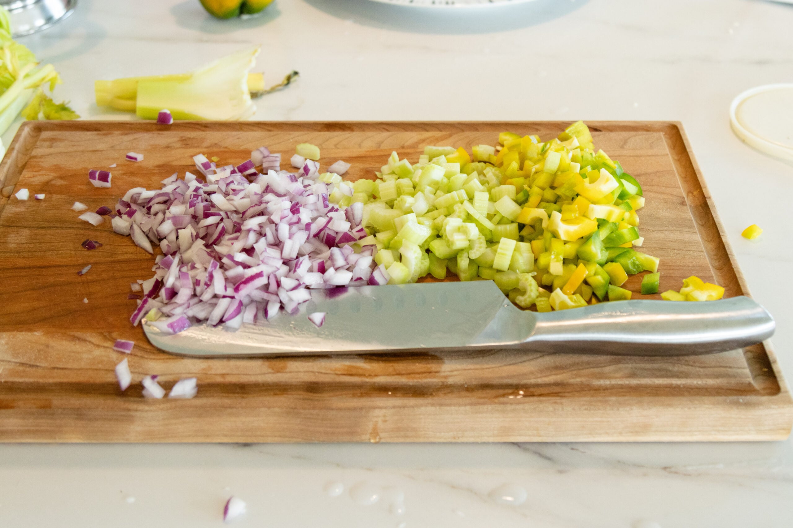 chopping the veggies on the cutting board