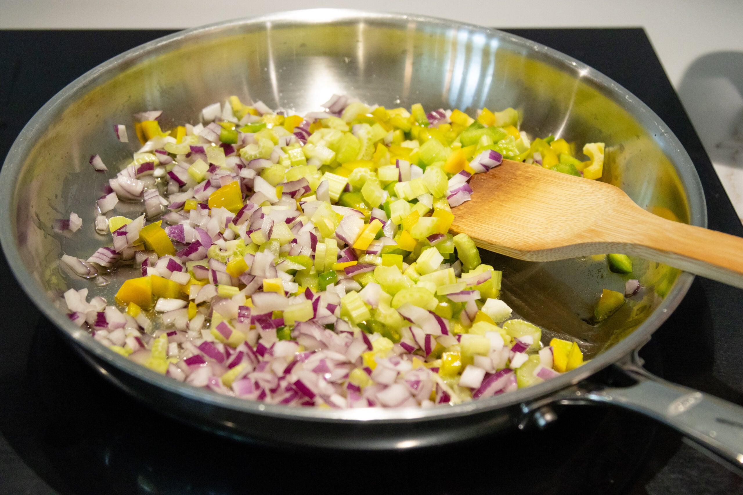 sautéing the veggies in a pan