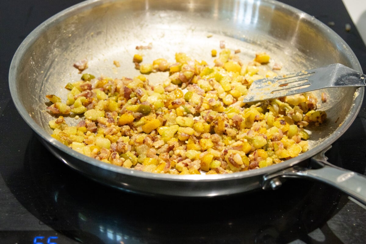browning the flour and veggies in the pan