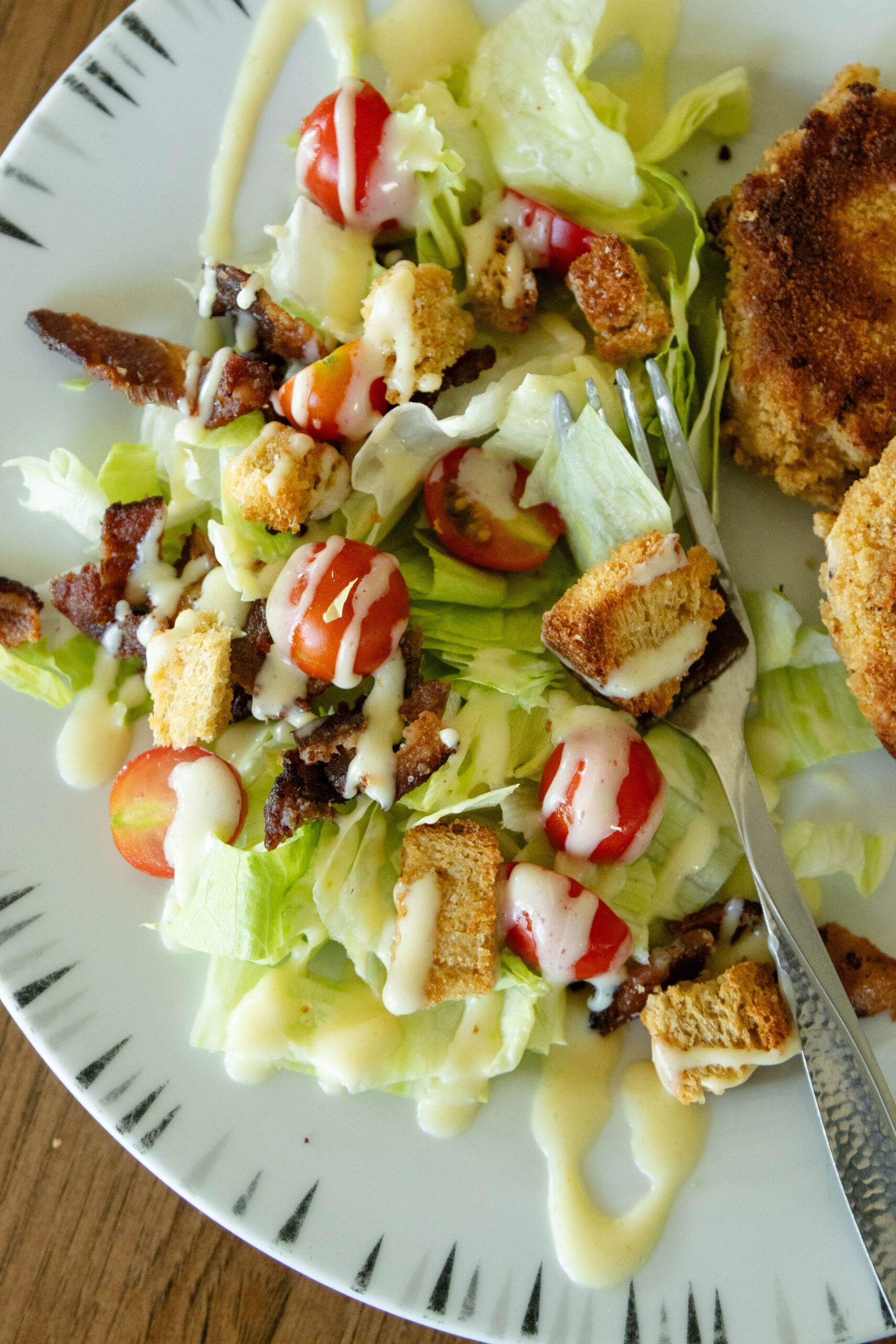 a side of blt salad on a white plate