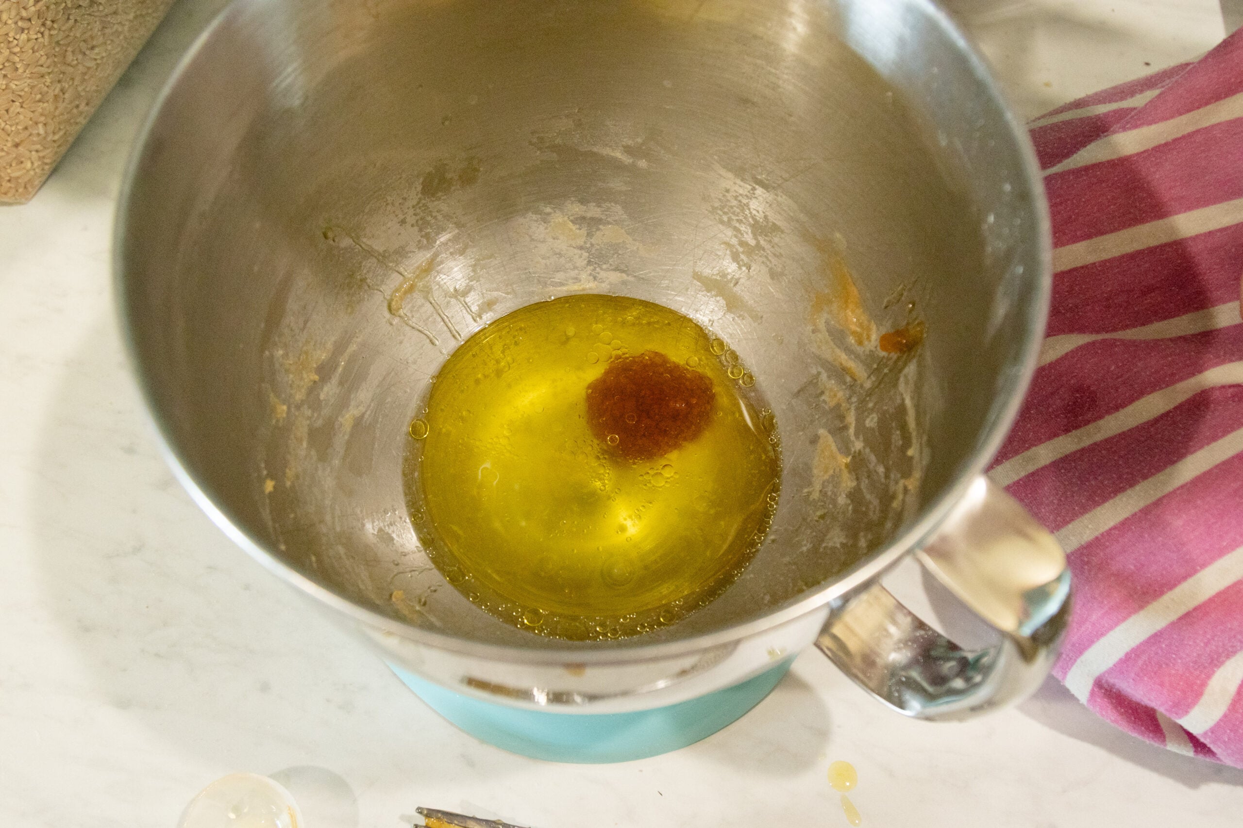 water, honey and oil in the mixer bowl